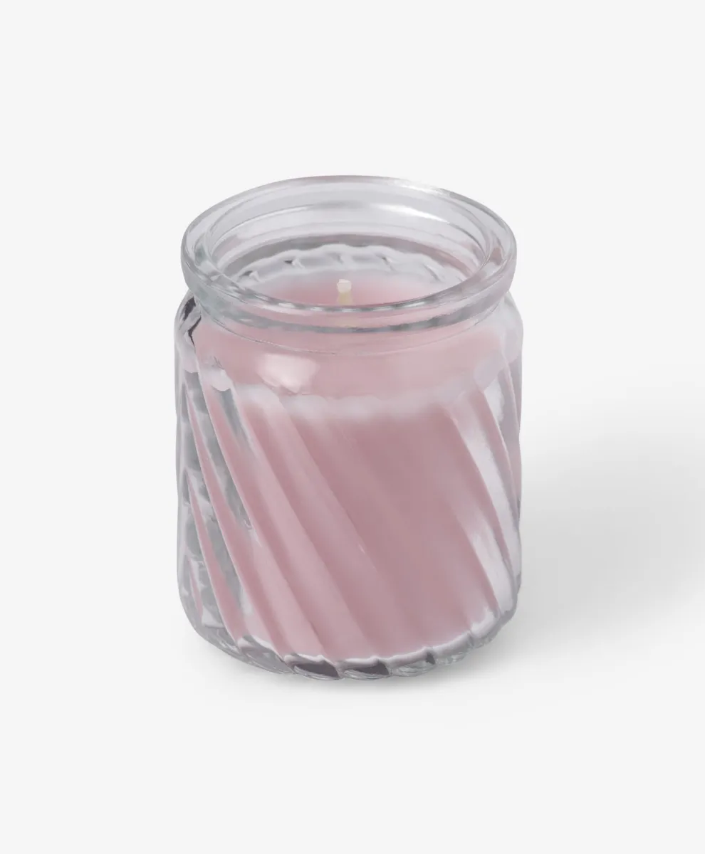 Roze sveća u staklenoj posudi